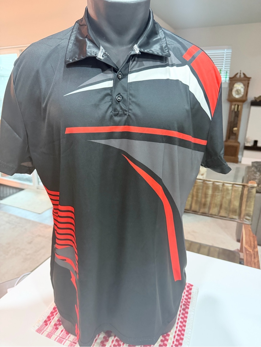 Men's Black Athletic Polo with Red and Gray Graphic Accents